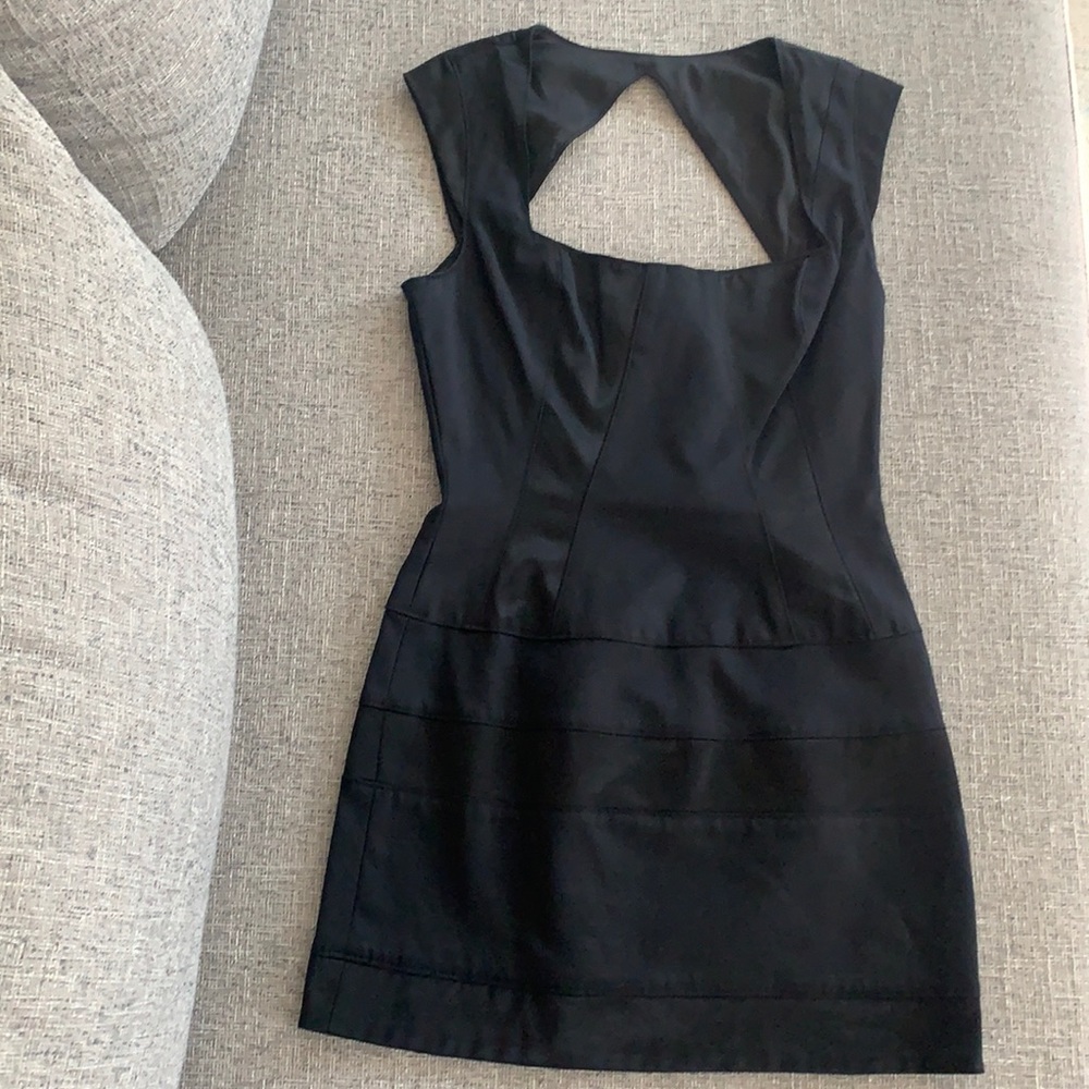 Like new Bebe black dress with left side zipper and clasp, size 4
